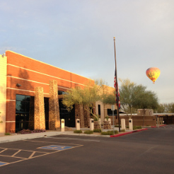 Office building with hot air ballon in background