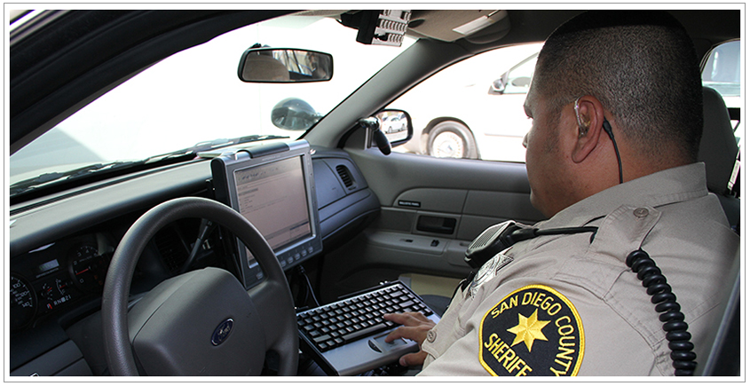 Officer at car computer
